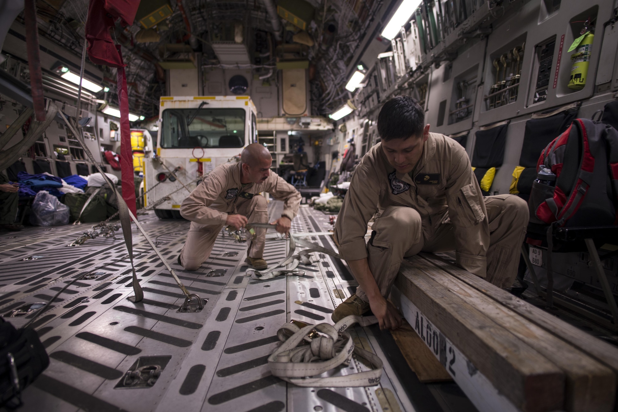 Marines assigned to Marine Corps Base Hawaii offload equipment from the back of a C-17 Globemaster III in preparation of the Langkawi International Maritime and Aerospace Exhibition March 16, 2015, in Langkawi, Malaysia. Defense Department participation in the LIMA 15 airshow strengthens military-to-military relationships and underscores the cooperation agreements between the U.S. and Malaysia. (U.S. Air Force photo/1st Lt. Elias Zani) 