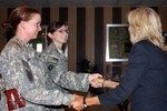 Dr. Jill Biden, wife of Vice President Joe Biden, talks with soldiers from the Texas Army National Guard on Camp Prosperity in Baghdad, July 5, 2010. Biden held a roundtable discussion with Guard members as an opportunity to hear their family concerns. 