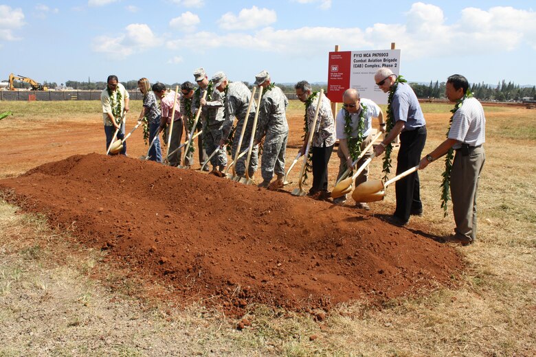 WHEELER ARMY AIRFIELD, Hawaii- Representatives from the U.S. Army Corps of Engineers-Honolulu District, U.S. Army Garrison-Hawaii Directorate of Public Works, the 25th Infantry Division Combat Aviation Brigade (CAB), and contractor Nan-Samsung LLC conduct the ceremonial groundbreaking for Phase 2 of the 25th ID CAB complex on the south side of the Wheeler airstrip.  The $69.7 million project is the second of 16 additional phases required to complete the entire $1.6 billion CAB complex. This project constructs two, six-story standard design barracks for Soldiers assigned to the Combat Aviation Brigade. 