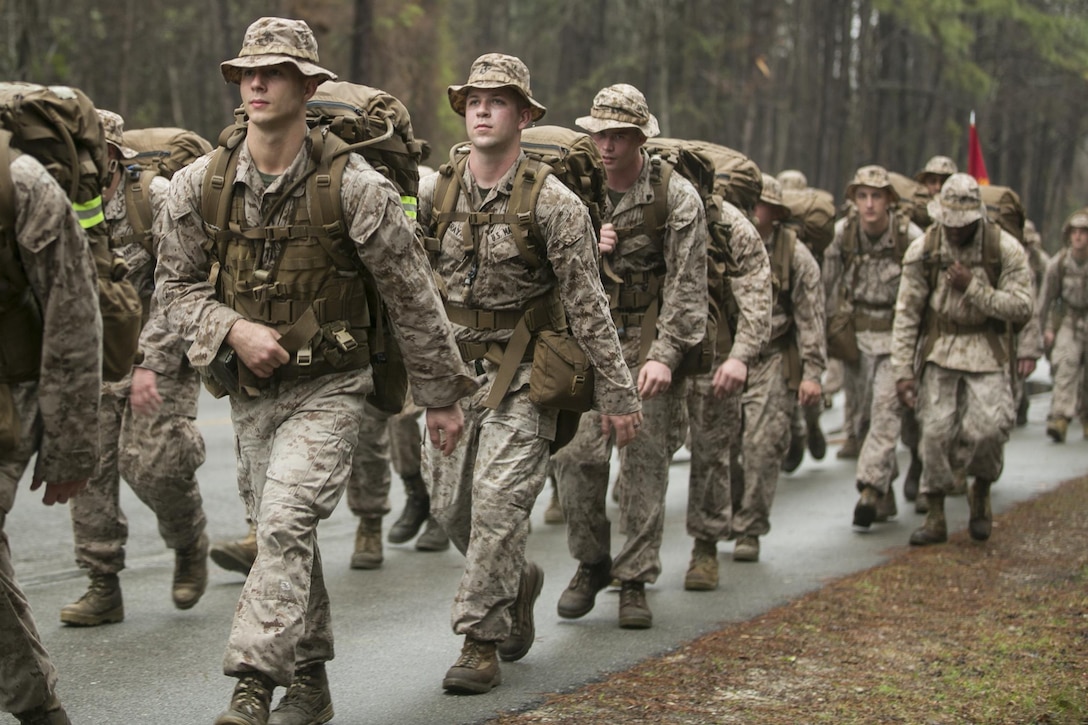 Marines with 2nd Battalion, 2nd Marine Regiment, hike aboard Camp Lejeune, North Carolina, March 20, 2015. The unit conducted the nine-mile march in preparation for an upcoming rotation to Okinawa, Japan, as part of the unit deployment program. (U.S. Marine Corps photo by Cpl. Elizabeth A. Case/Released)