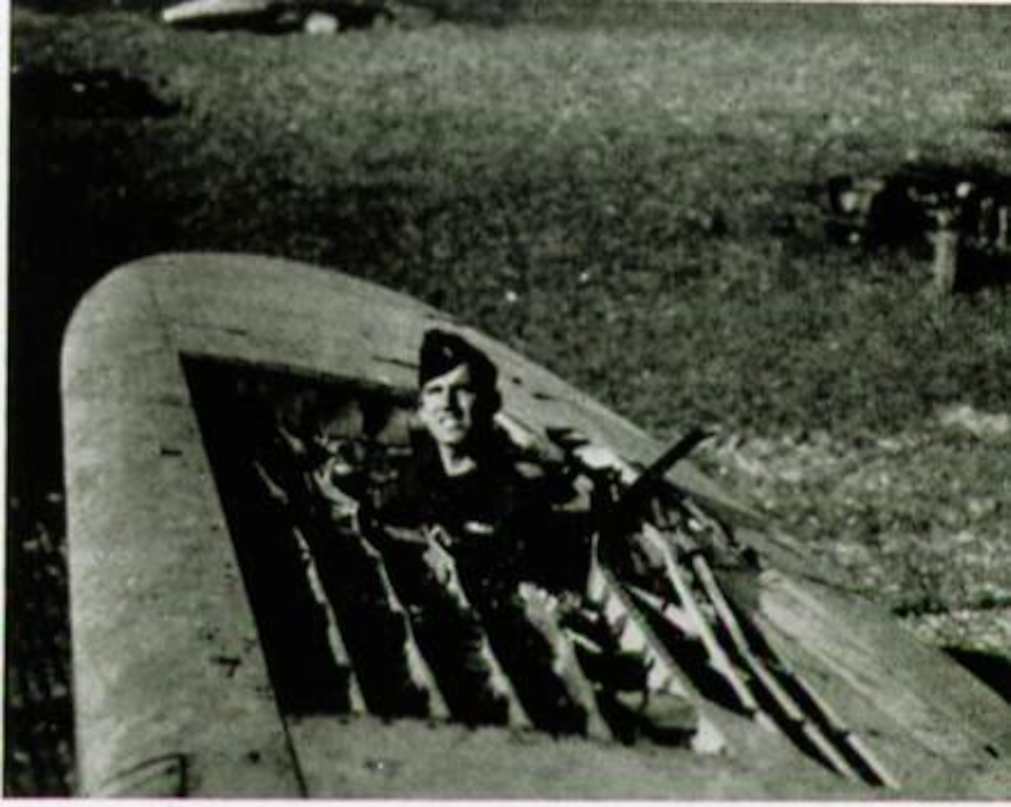 Battle damage like this was not unusual, as 1st Lt. Robert L. Griffith of the 405th Fighter Squadron demonstrates in early 1945.  It took expert piloting to bring these ships in after a rough mission.  (The Story of the 371st Fighter Group in the E.T.O.)

