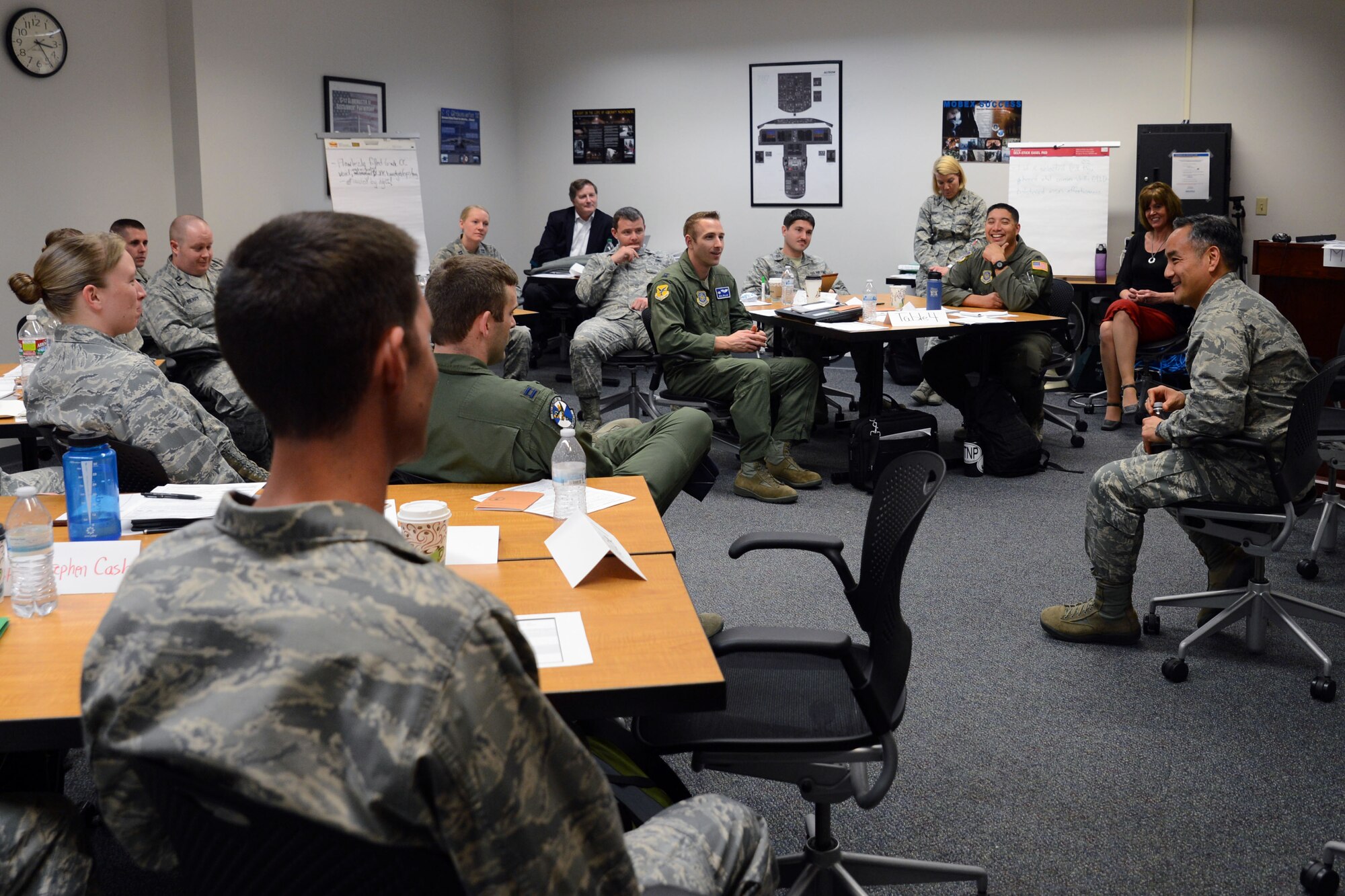 Col. David Kumashiro (right), 62nd Airlift Wing commander, speaks with flight commanders from various bases throughout Air Mobility Command during the AMC Flight Commanders Leadership Development Course Mar. 19, 2015, at Joint Base Lewis-McChord, Wash. Kumashiro shared personal stories about his career with the junior officers, and gave his thoughts and advice for the future of the Air Force. (U.S. Air Force photo/Senior Airman Rebecca Blossom)