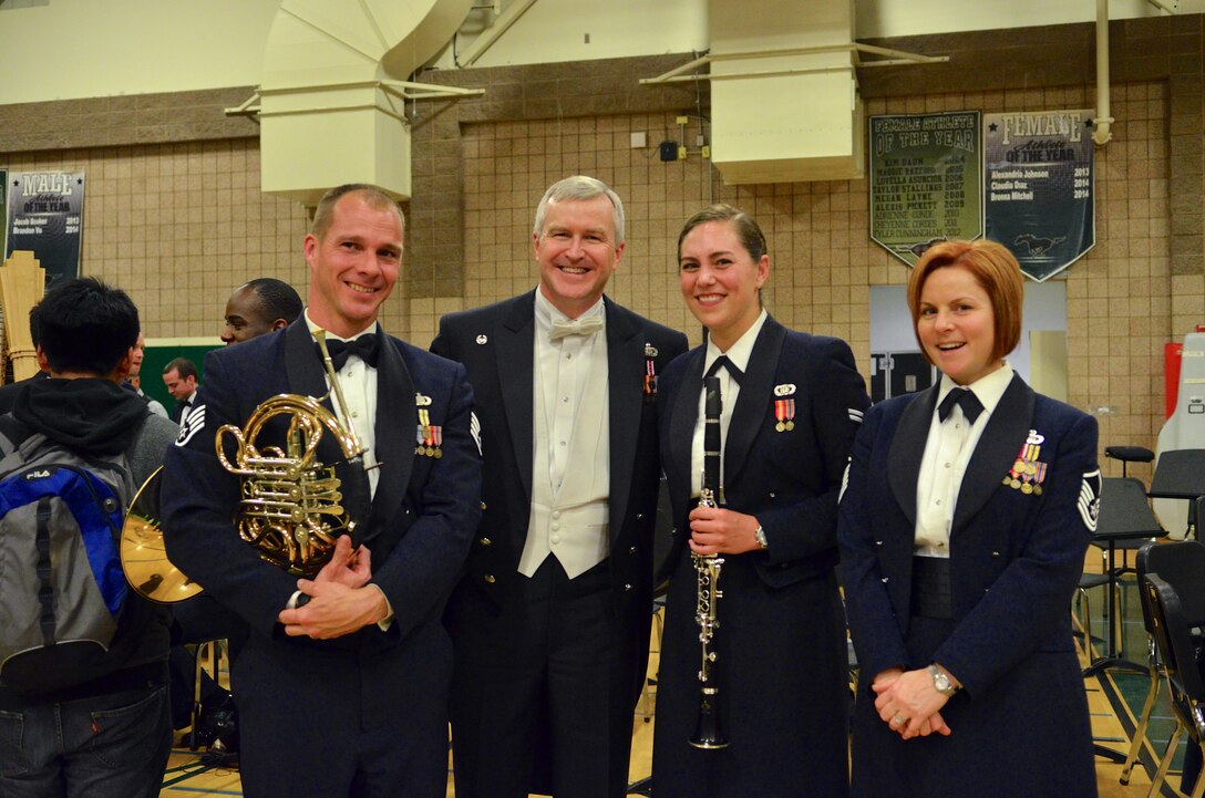The US Air Force Band of the Golden West's Staff Sgt. Robbie Mayes, Airman 1st Class Alaina Pritz, & Master Sgt. Sherry Garza pose with Col. Larry Lang, conductor of the US Air Force Band from Washington, D.C. They augmented the D.C. band in its Fairfield, Calif. performance March 7th. (U.S. Air Force photo / Senior Master Sgt. Bob Kamholz)