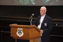 Retired Air Force Col. Carlyle Harris, former Vietnam War POW, speaks about his experiences in captivity March 20 at the 18th Annual POW/MIA Symposium, hosted by the 560th Flying Training Squadron at the Joint Base San Antonio-Randolph Fleenor Auditorium. Harris was released Feb. 12, 1973 after being held for eight years. His aircraft was shot down by an anti-aircraft April 4, 1965 during a bombing run on the Ham Rong Bridge at Than Hoa.  The annual Freedom Flyer Reunion tradition began when the 560th FTS was given the task to retrain more than 150 POWs returning to flying status toward the end of American involvement in the Vietnam War. (U.S. Air Force photo by Johnny Saldivar)