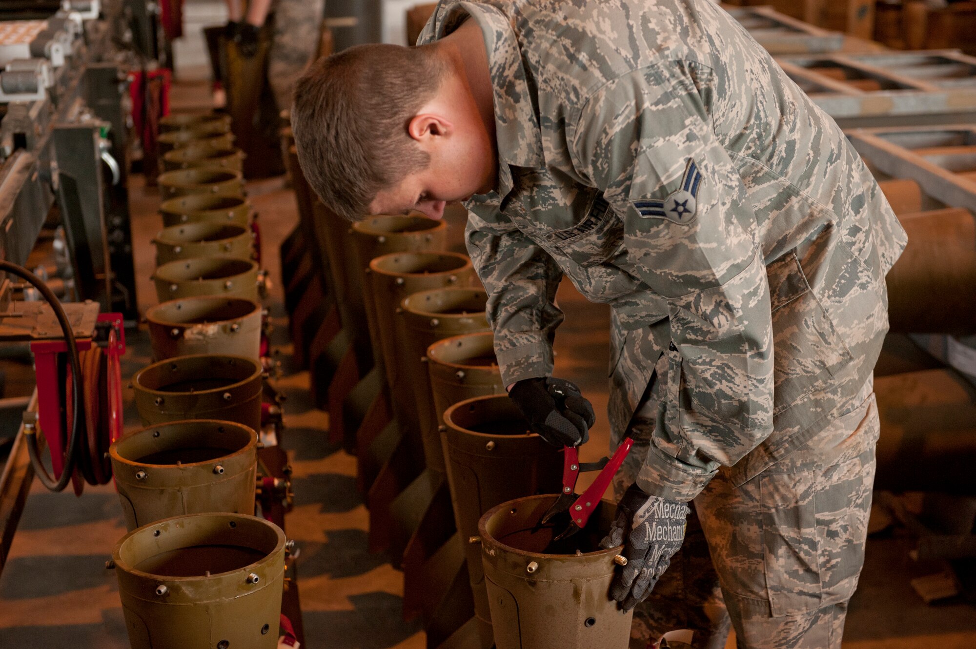 Airman 1st Class Joshua Baldridge, 49th Wing Conventional Munitions Crew Member, prepares the conical fin assembly of a Mark 82 bomb that will be used during training with new F-16 aircraft pilots under the 54th Fighter Group at Holloman Air Force Base/White Sands Missile Range, N.M., March 17, 2015. The Mark 82 is the perfect munition for training in a controlled environment, and has a rich history in the Air Force dating back to before the Vietnam War.