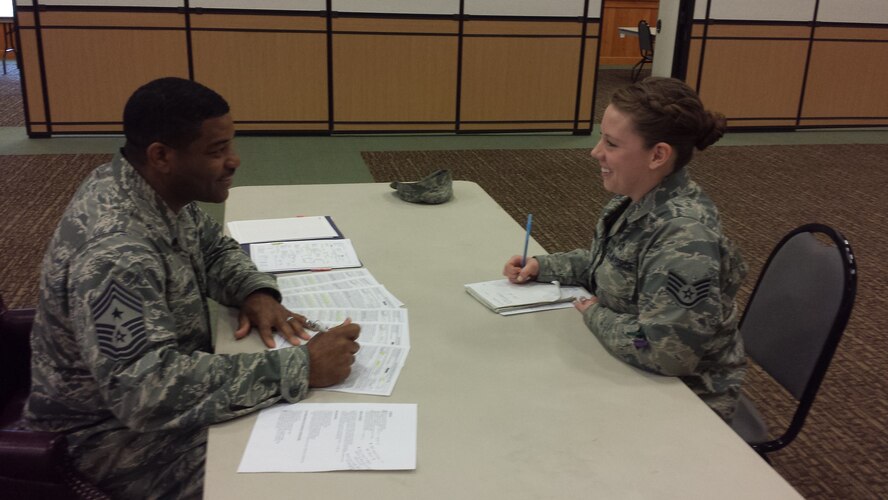 Chief Master Sgt. Phillip Easton, (left) 341st Missile Wing command chief evaluates and provides Staff Sgt. Shelby McCrief 819th RED HORSE operations management craftsman, with feedback on enlisted performance reports and future promotion packages during the Pathway to Promotion Program March 17 at Malmstrom Air Force Base, Mont. The program is provides Airmen and non-commissioned officers with a one-on-one mock promotion board evaluation. (Courtesy photo)