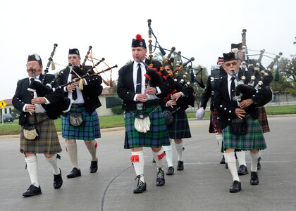 Members of the San Antonio Pipes and Drums perform during the opening ceremony of the 42nd Freedom Flyer Reunion and 18th Annual POW/MIA Symposium, which honors all POWs held captive during the Vietnam War and was held March 20 at Joint Base San Antonio-Randolph. The tradition began when members of the 560th Flying Training Squadron were given the task to retrain more than 150 POWs returning to flying status.  To honor their return, their initial training included a “freedom flight.” (U.S. Air Force Photo by Harold China/released)