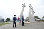 Airman 1st Class Hayden Tondee (left) and Senior Airman Willie Muhammad (right), Joint Base San Antonio Honor Guard members, stand at the Missing Man Memorial before the  wreath laying ceremony, which was held in conjunction with the 42nd Freedom Flyer Reunion March 20 at JBSA-Randolph.