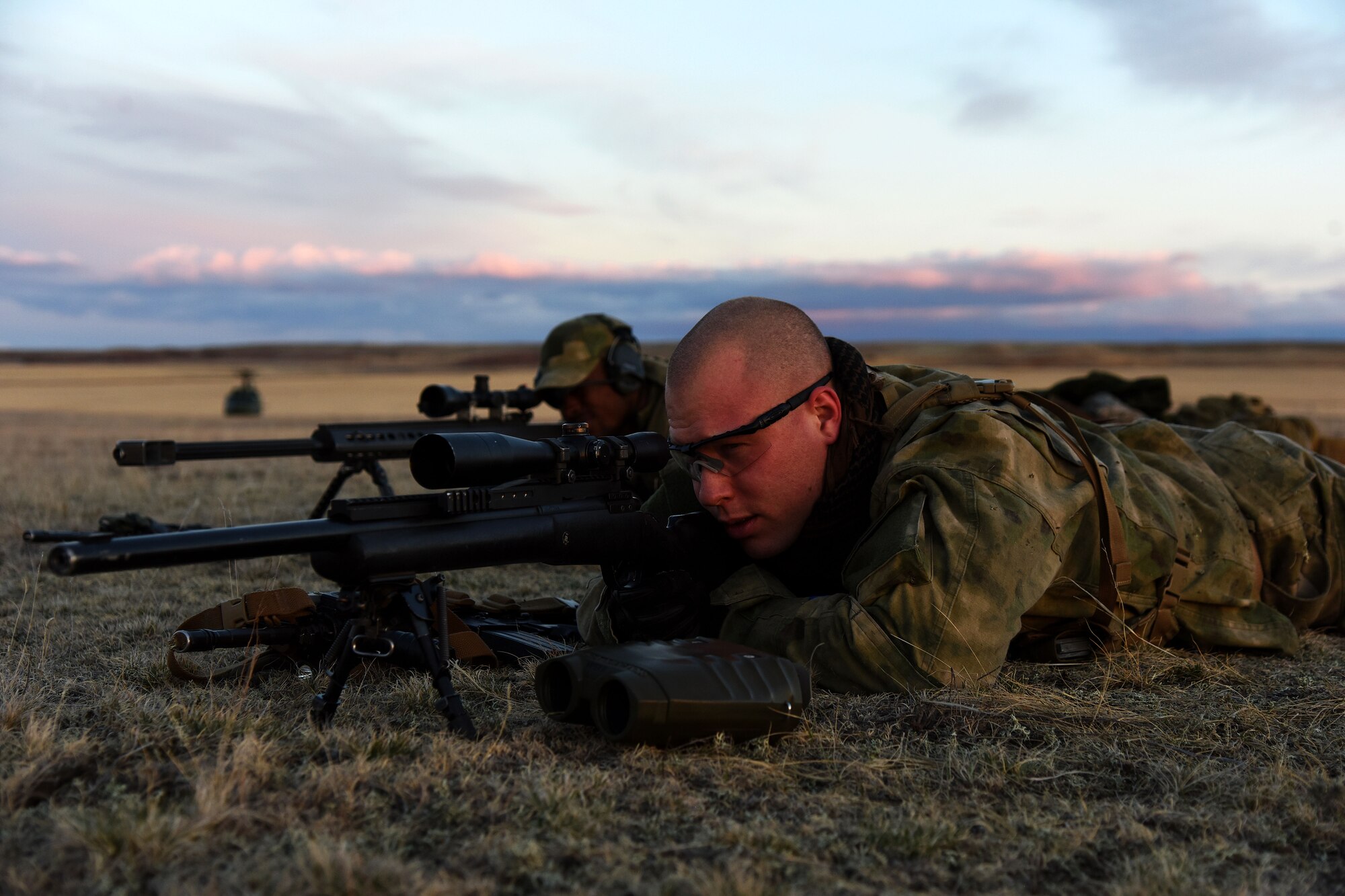Snipers from the 341st Security Forces Support Squadron tactical response force provide cover during a missile launch facility recapture simulation as part of the Grizzly Rampart training exercise March 18 near Malmstrom Air Force Base. The exercise was implemented to evaluate the readiness of the 341st Missile Wing and ensure first-responder Airmen know and follow the standards set in place for real-world events. (U.S. Air Force photo/Airman 1st Class Collin Schmidt)