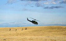 A flight crew from the 40th Helicopter Squadron drops off members of the 341st Security Forces Support Squadron tactical response force team during a simulated a launch facility recapture as part of the Grizzly Rampart training exercise March 18 near Malmstrom Air Force Base. The exercise was implemented to evaluate the readiness of the 341st Missile Wing and ensure first-responder Airmen know and follow the standards set in place for real-world events. (U.S. Air Force photo/Airman 1st Class Collin Schmidt)