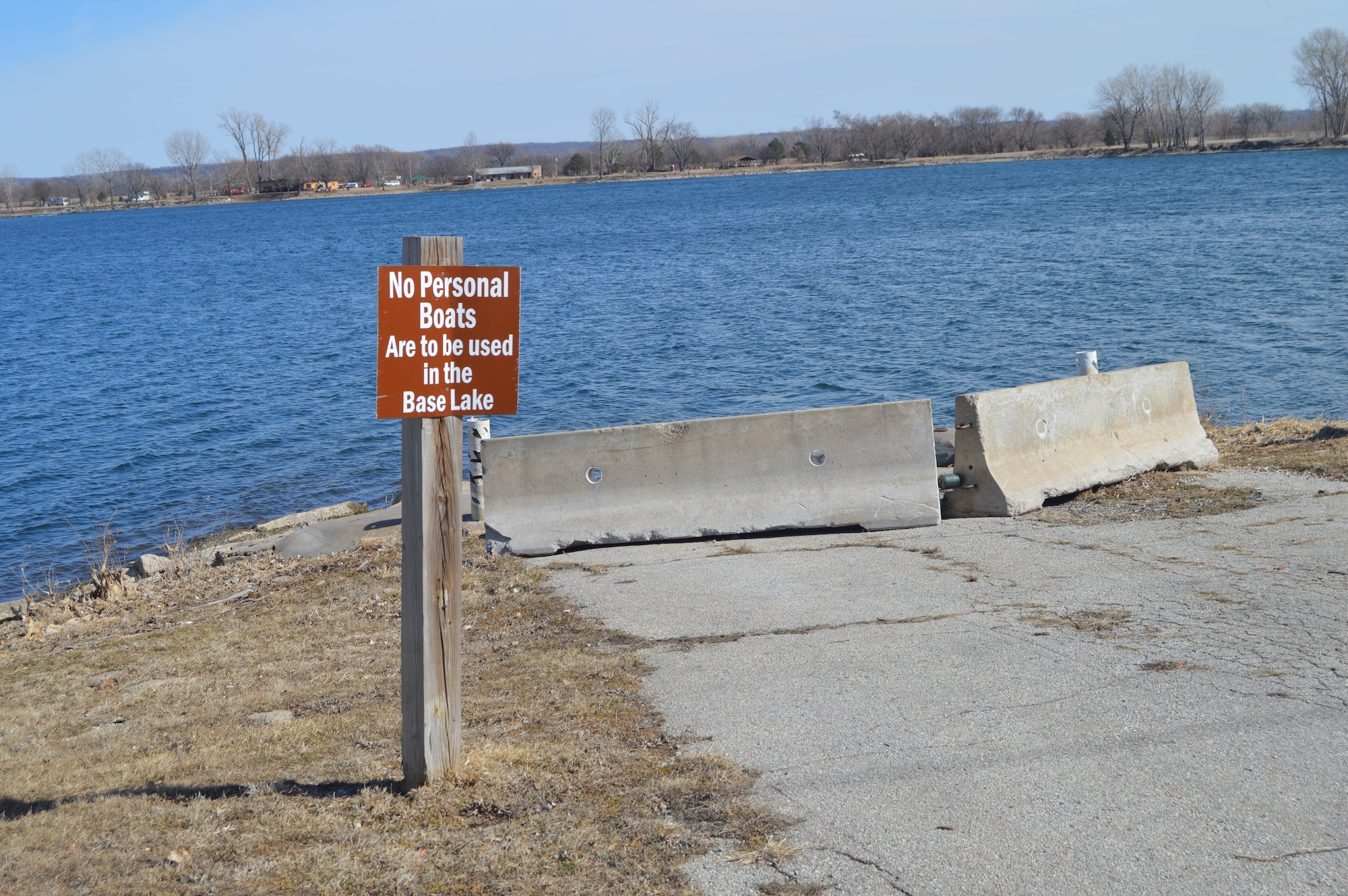 A sign prohibiting the use of personal watercraft is displayed at the base lake March 13, 2015, Offutt Air Force Base, Neb. This is one of the measures to decrease the chance of Zebra mussels from moving to other bodies of water. (U.S. Air Force photo by Staff Sgt. Dallas Edwards/Released)