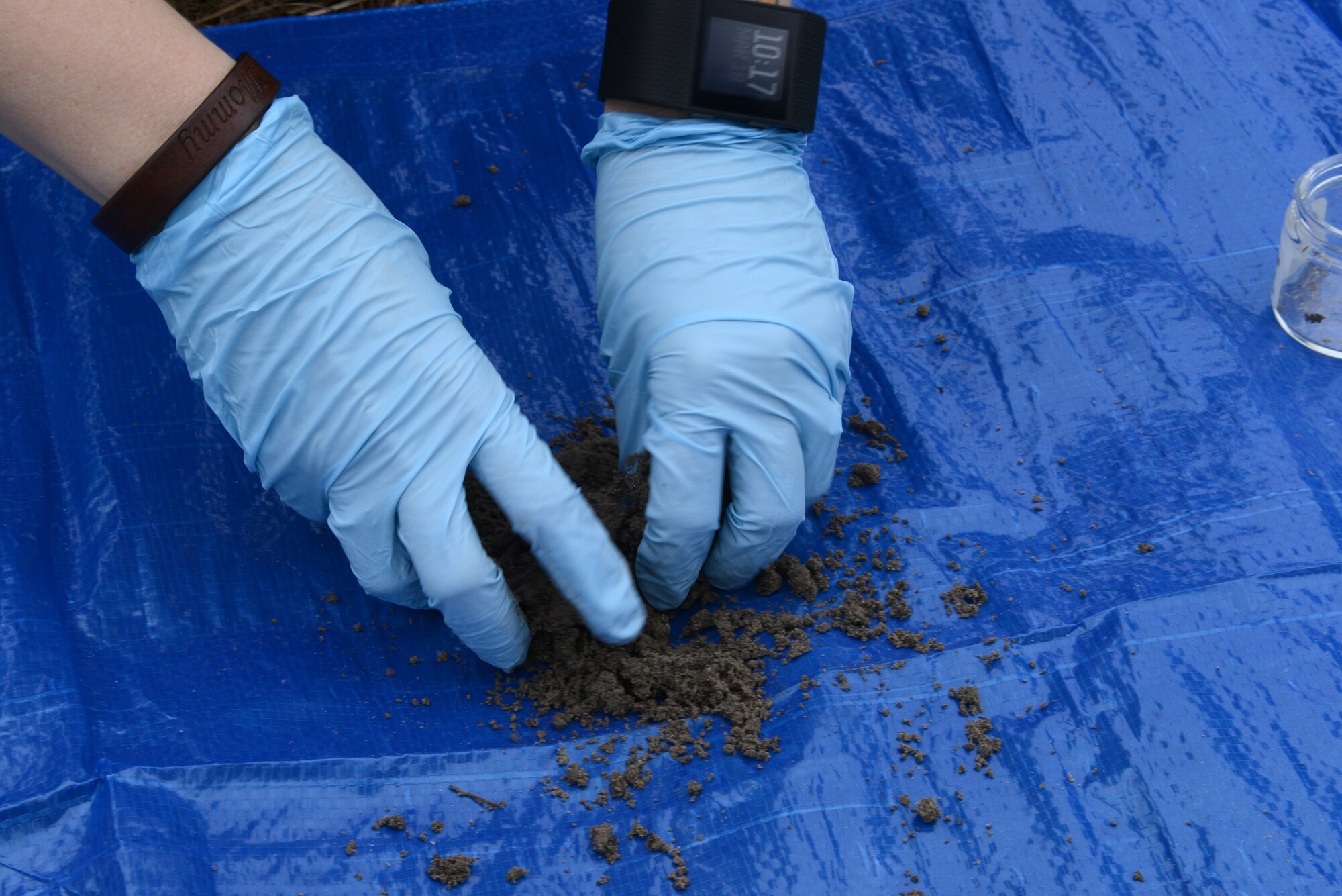 A 23d Aerospace Medicine Squadron bioenvironmental technician takes an environmental sample during integrated base emergency response capability training March 19, 2015, at Moody Air Force Base, Ga. Gillespie created a composite sample in order to test a wider range of the area. (U.S. Air Force photo by Airman 1st Class Kathleen D. Bryant)