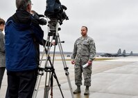 Senior Master Sgt. Kevin Massie, superintendent of the 76th Aerial Port Squadron (APS) here, talks to local media representatives about a Denton cargo mission to Guatemala march 20, 2015. Massie and other Airmen from APS packaged approximately 90 thousand pounds of cargo onto Air Force pallets which were picked up by an aircrew from Dover Air Force Base, Delaware via a C-5 Super Galaxy aircraft. The cargo, which included school supplies, medical items and furniture, was collected by Austintown based Mission of Love charity. U.S. Air Force photo/Eric M. White.
