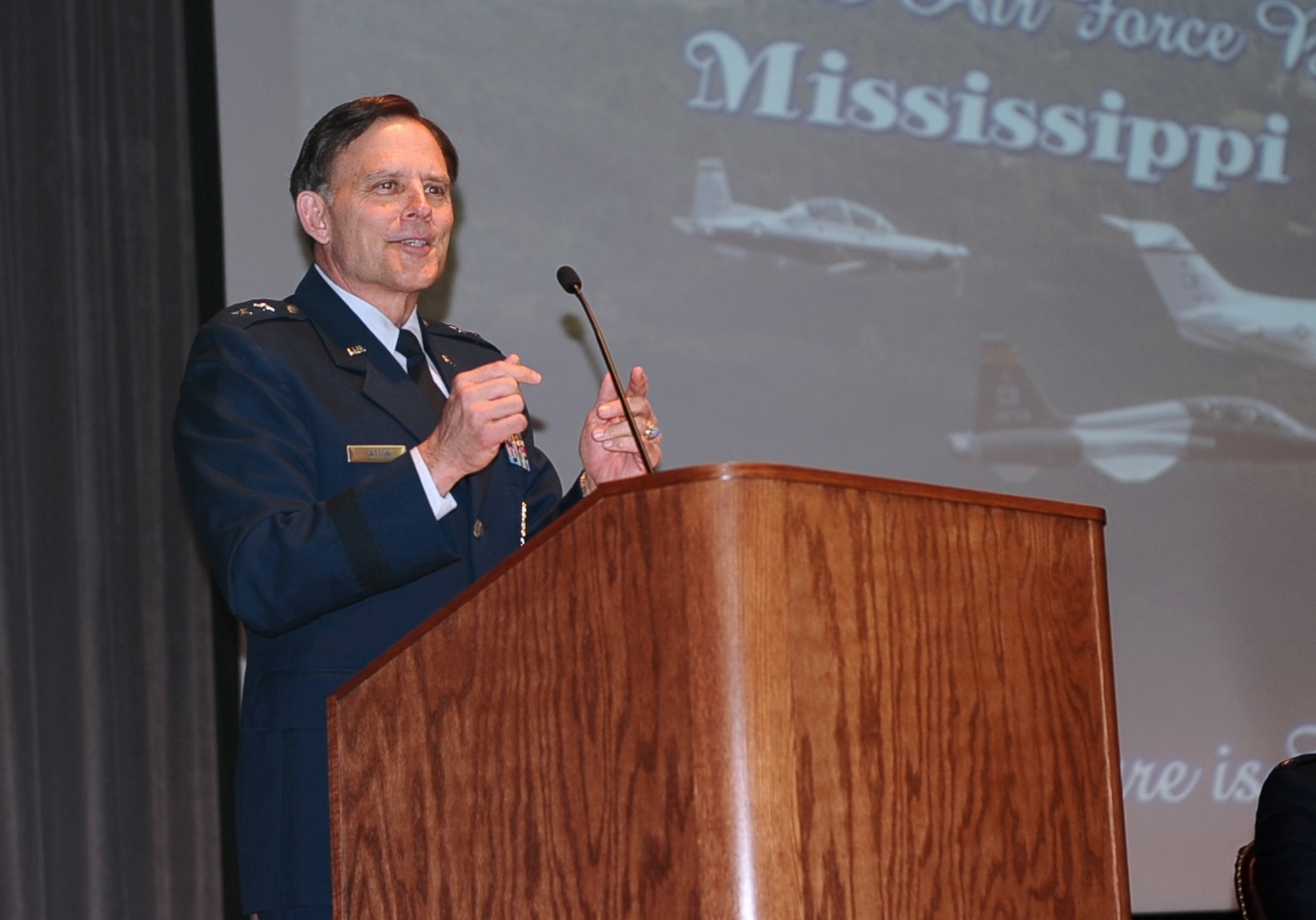 Retired Maj. Gen. Jack Catton speaks at Specialized Undergraduate Pilot Training Class 15-06’s graduation March 13 at Kaye Auditorium. Catton, a former 14th Flying Training Wing commander, is known to Columbus as the “father of BLAZE.” (U.S. Air Force Photo/Airman Daniel Lile)