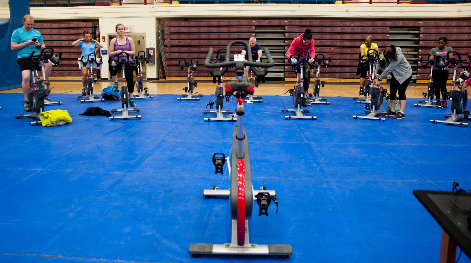 Service members and family members prepare to begin a spin class on Joint Base Elmendorf-Richardson, Alaska, March 10, 2015. Both the Buckner Physical Fitness Center and Elmendorf Fitness Centers provide all JBER’s patrons the opportunity to partake in morning, afternoon and weekend classes, such as spin class, Insanity and Zumba. (U.S. Air Force photo/ Airman 1st Class Tammie Ramsouer)