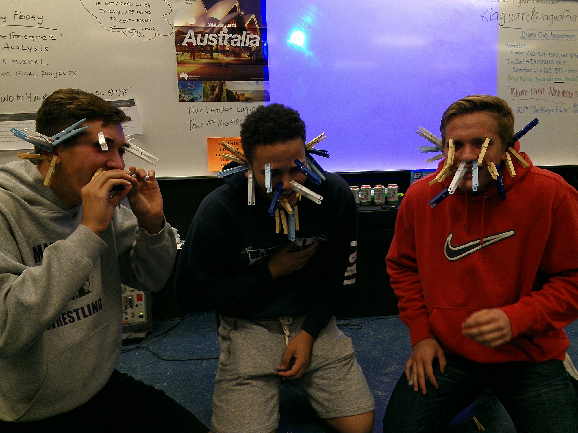 Charles and Joe compete to see who can attach the most clothespins to their faces Dec. 1, 2014, at Club Five Six. Club Beyond has more than 100 trained staff and hundreds of volunteers at over 40 locations worldwide. (Courtesy photo)