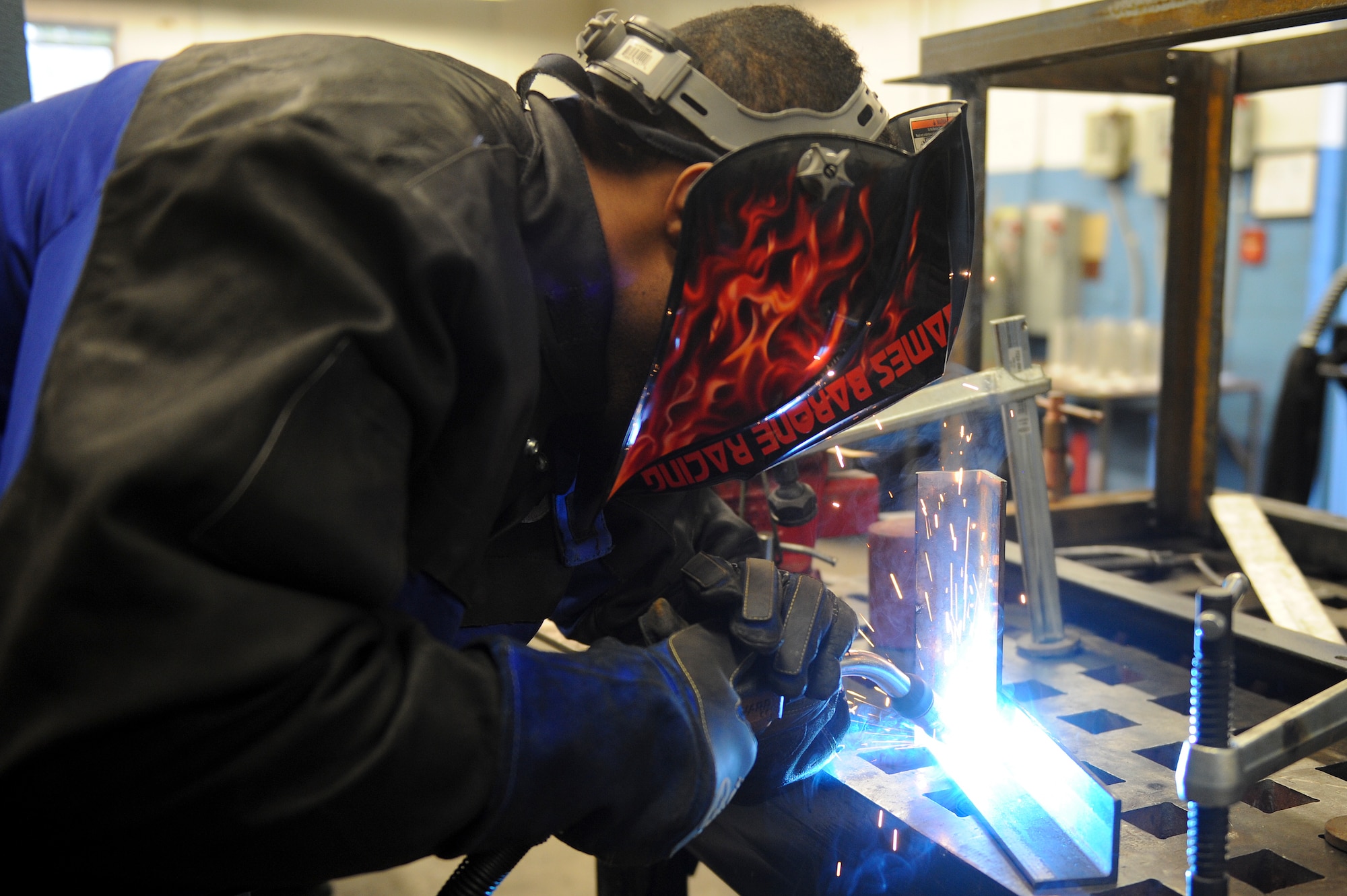 Senior Airman Caleb Wren, 4th Equipment Maintenance Squadron aircraft metals technology technician welds a piece of angle iron with a metal inert gas welder March 10, 2015, at Seymour Johnson Air Force Base, North Carolina. AMT Airmen undergo extensive training to become proficient in welding using three different machines. (U.S. Air Force photo/Airman 1st Class Aaron J. Jenne)