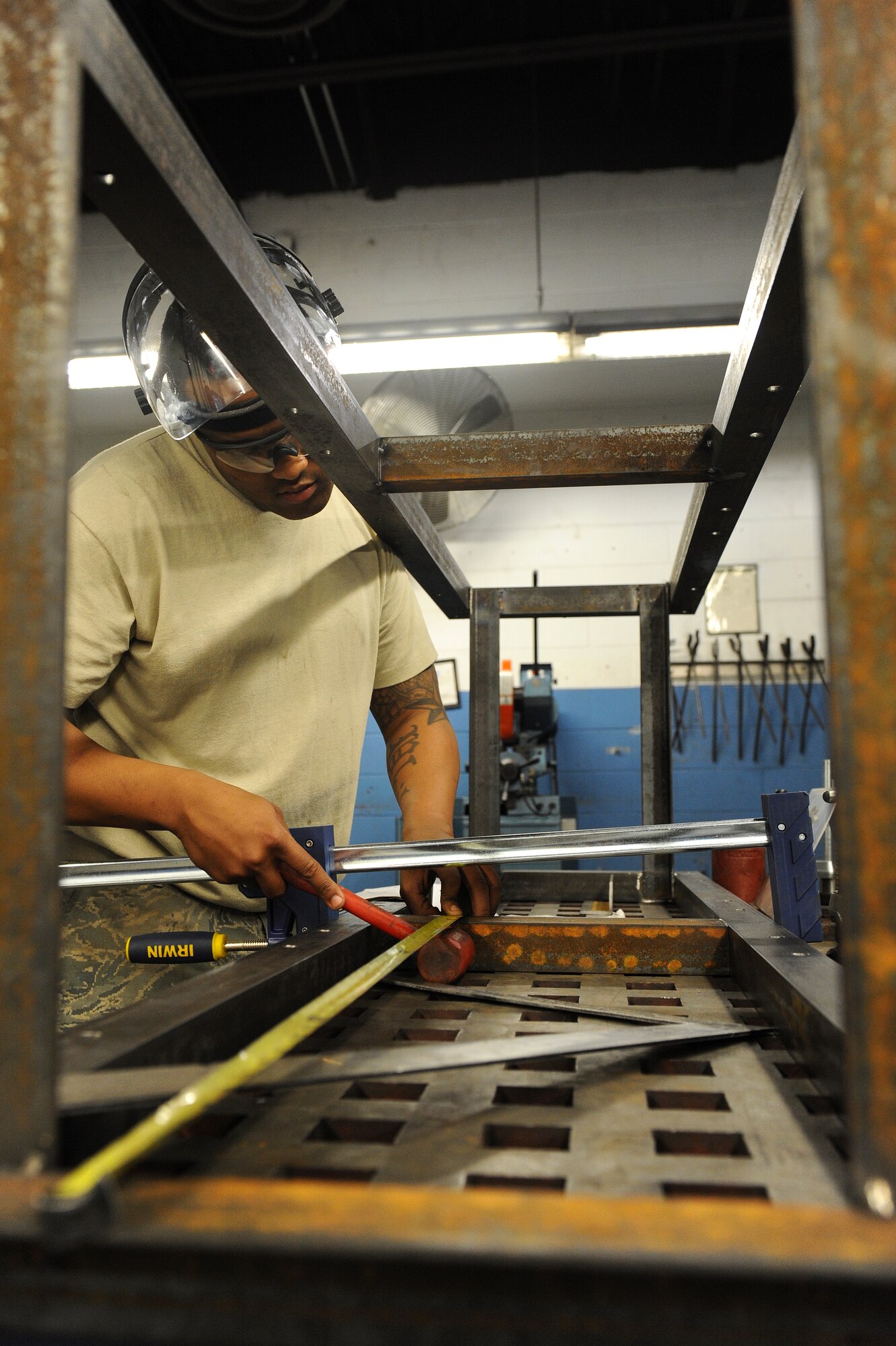 Senior Airman Caleb Wren, 4th Equipment Maintenance Squadron aircraft metals technology technician, aligns a brace on a gun tower March 10, 2015, at Seymour Johnson Air Force Base, North Carolina. The AMT shop primarily repairs or replaces aircraft parts, however it also supports other units such as the 4th Aircraft Maintenance Squadron, 4th Force Support Squadron and the 916th Air Refueling Wing. (U.S. Air Force photo/Airman 1st Class Aaron J. Jenne)