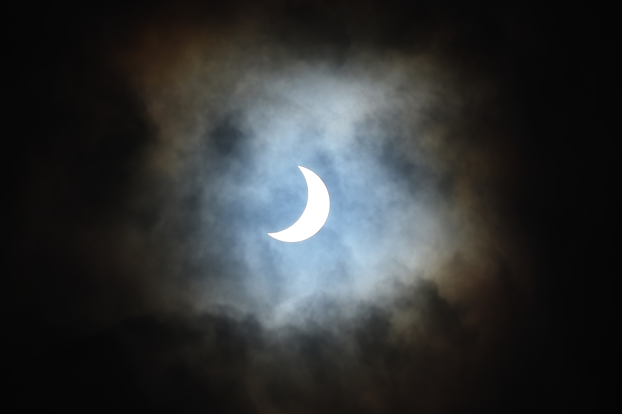 The moon moves past its position between the sun and the Earth at 9:56 a.m. during a solar eclipse, visible from RAF Alconbury, England, March 20, 2015. An 83 percent eclipse was visible throughout the entire United Kingdom. (U.S. Air Force photo by Staff Sgt. Jarad A. Denton/Released)