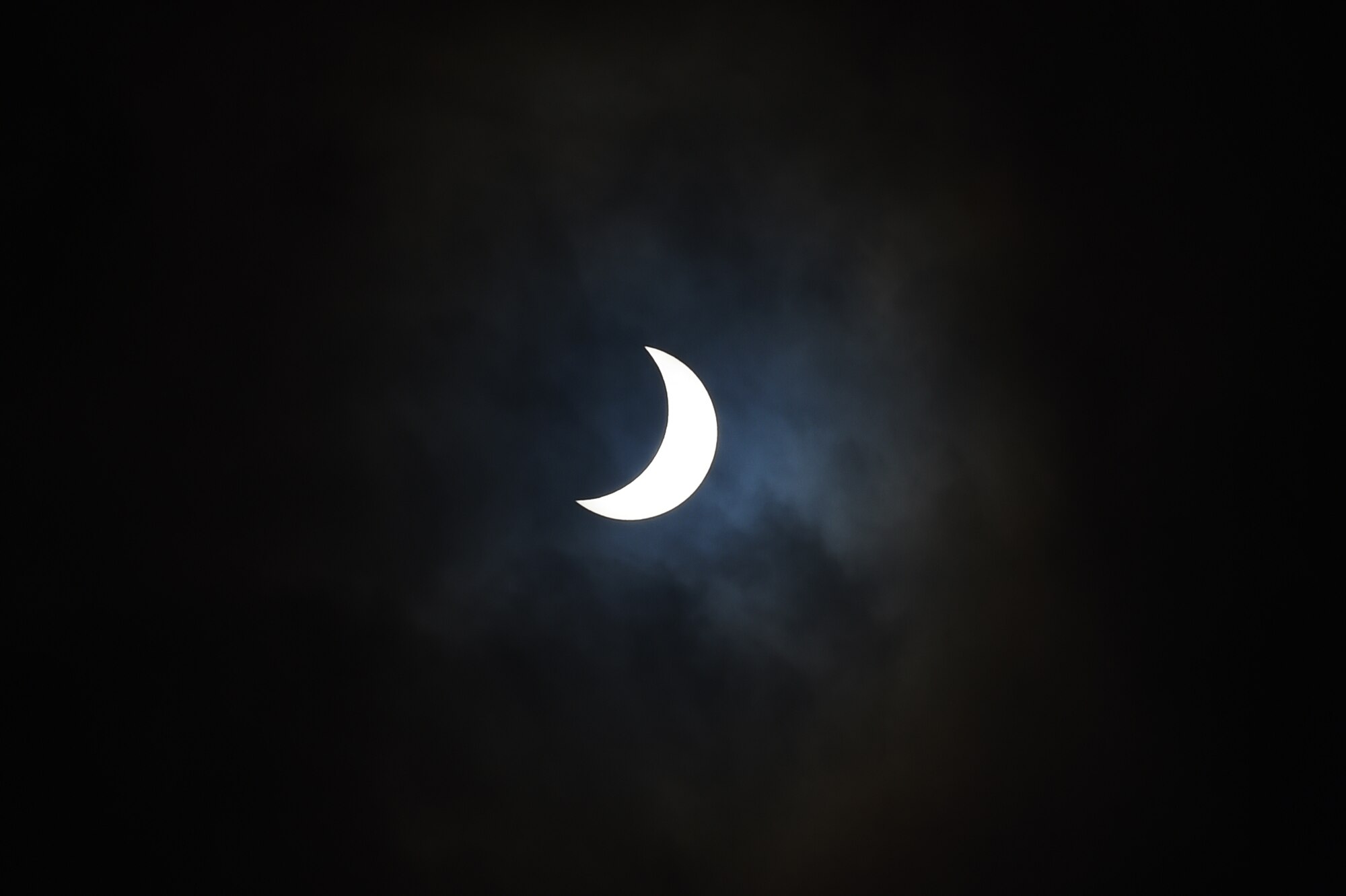 The moon moves past its position between the sun and the Earth at 9:55 a.m. during a solar eclipse, visible from RAF Alconbury, England, March 20, 2015. The United Kingdom will not see a solar eclipse of this scale again until 2026. (U.S. Air Force photo by Staff Sgt. Jarad A. Denton/Released)