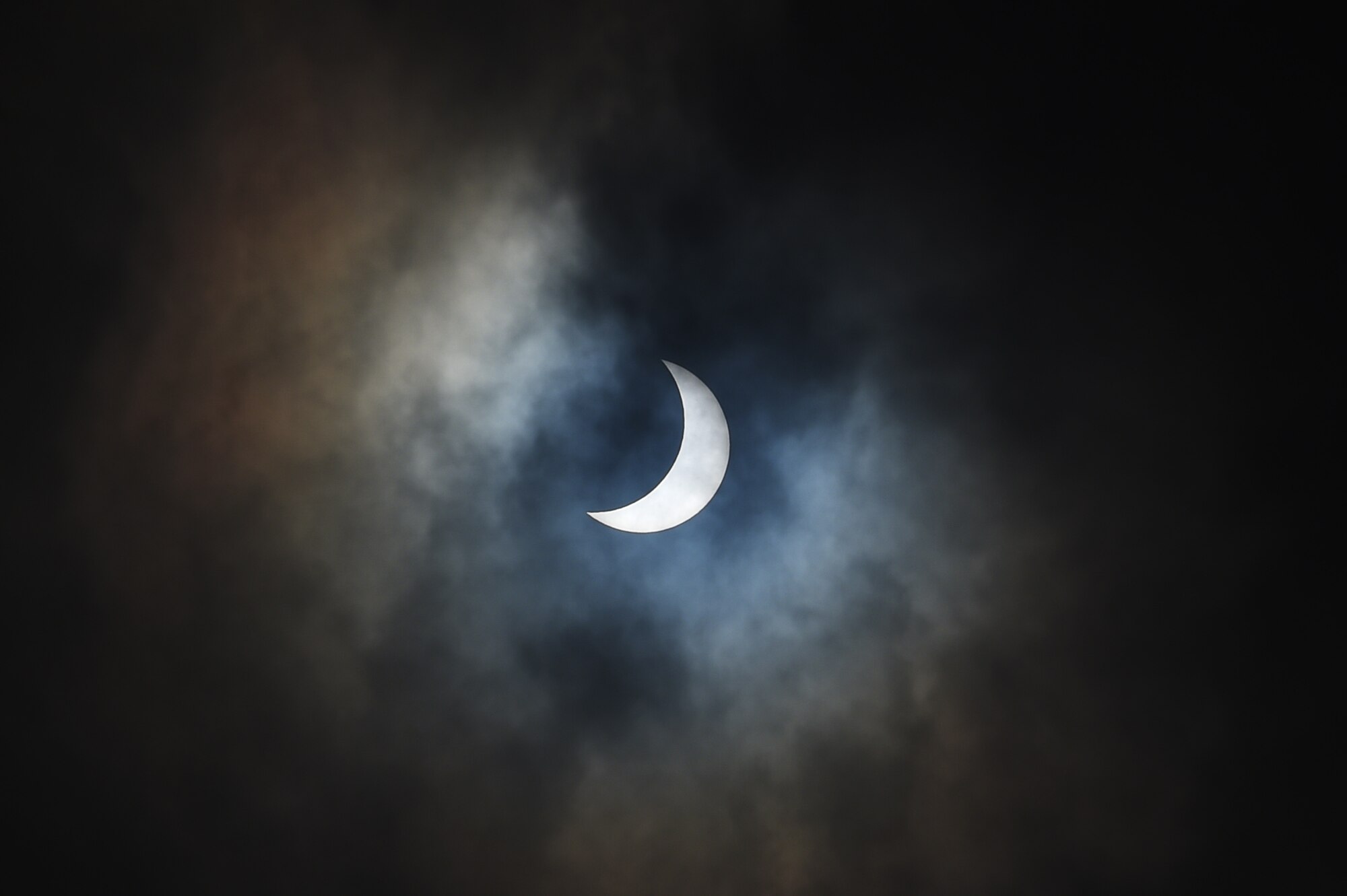 The moon moves past its position between the sun and the Earth at 9:54 a.m. during a solar eclipse, visible from RAF Alconbury, England, March 20, 2015. The United Kingdom will not see a solar eclipse of this scale again until 2026. (U.S. Air Force photo by Staff Sgt. Jarad A. Denton/Released)