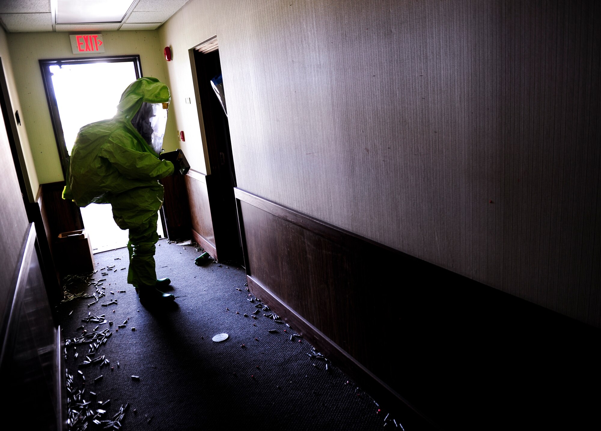 U.S. Air Force Senior Airman Aaron Rogers, 18th Aerospace Medicine Squadron bioenvironmental engineering technician, enters the scene of a potentially hazardous environment during an Integrated Base Emergency Response Capabilities Training exercise March, 18 2015, at Kadena Air Base, Japan. Bioenvironmental Engineering Airmen are trained to survey unknown areas slowly to allow their instruments time to detect radiation or other hazards. (U.S. Air Force photo by Airman 1st Class John Linzmeier)