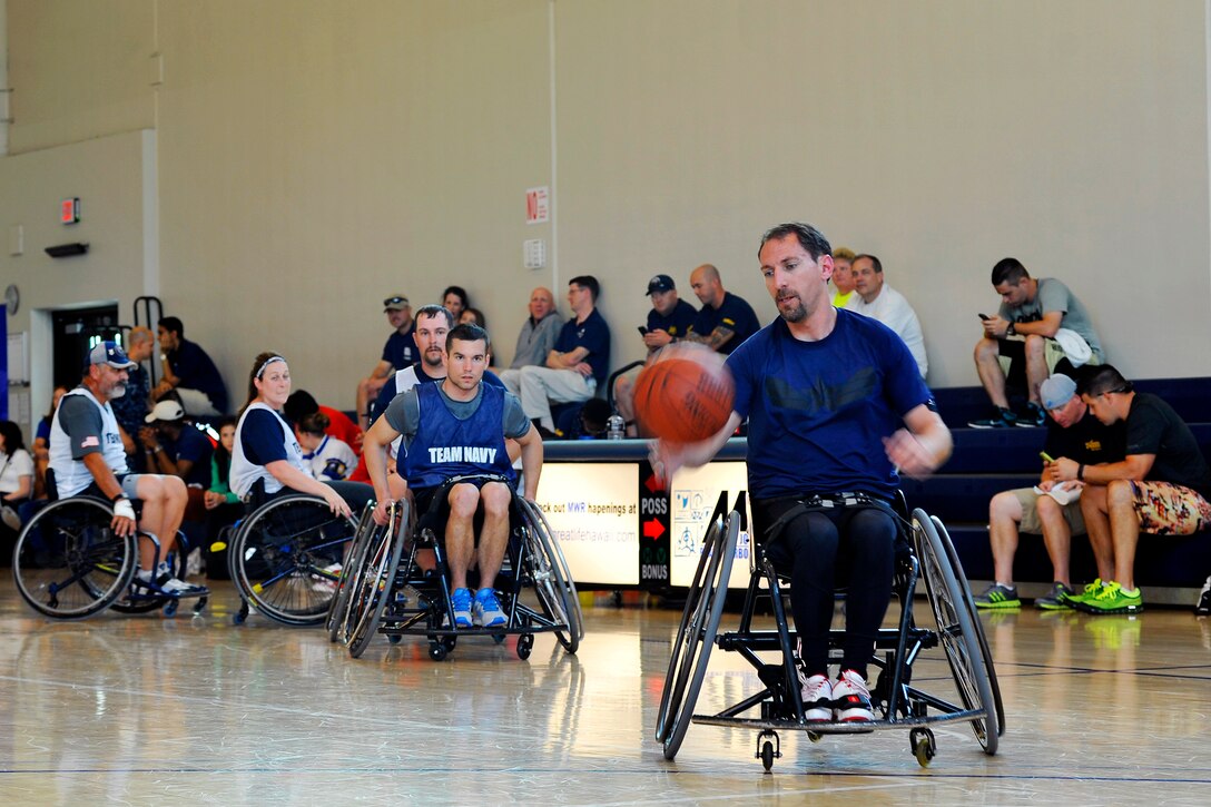 Retired Navy Lt. Steve Simmons does layup drills before a basketball game at the 2015 Wounded Warrior Pacific Trials on Joint Base Pearl Harbor-Hickam, March 12, 2015.