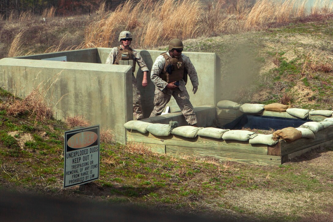 Marines practice hand grenade throwing with Headquarters Battery, 2nd Battalion 10th Marine Regiment on Fort Bragg N.C., March 10, 2015. 