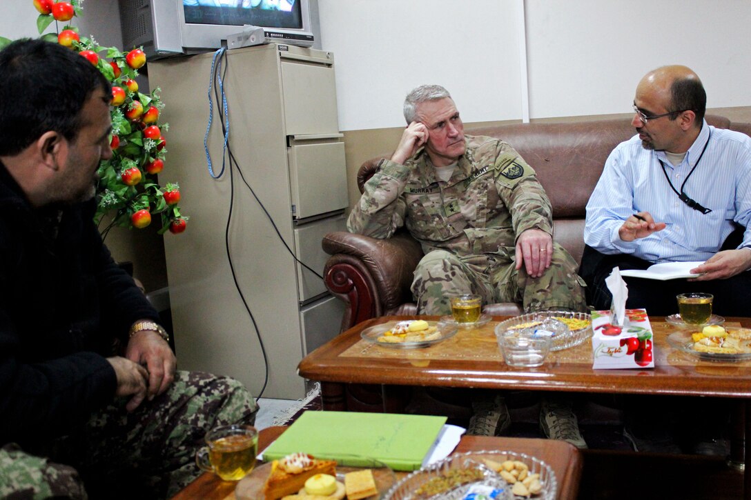U.S. Army Maj. Gen. Mike Murray, center, deputy commander, U.S. Forces Afghanistan Support, meets with Afghan Maj. Gen. Safi Safiullah, commander, Military Police Guard in Parwan province, Afghanistan, March 11, 2015.