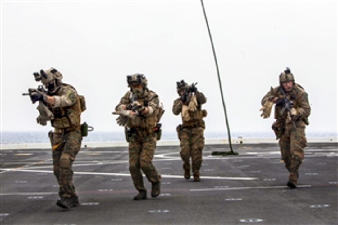 U.S. Marines conduct a fast-rope exercise as part of amphibious integration training aboard the USS Green Bay at sea, March 10, 2015. The Marines, assigned to Maritime Raid Force, 31st Marine Expeditionary Unit, are conducting a spring patrol with sailors in the Asia-Pacific region.