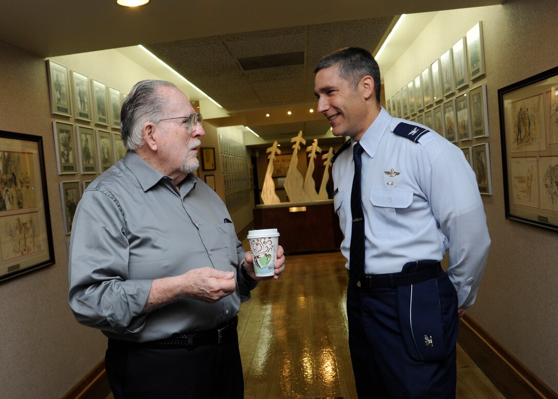 Retired Col. Ronald E. Byrne (left) speaks with Col. Matthew Isler, 12th Flying Training Wing commander, at the 42nd Freedom Flyer Reunion at Joint Base San Antonio-Randolph March 20.  The event honors all POWs held captive during the Vietnam War. The tradition began when members of the 560th Flying Training Squadron were given the task to retrain more than 150 POWs returning to flying status.  To honor their return, their initial training included a “freedom flight.” The last group of POWs was released from captivity in North Vietnam March 1973. (U.S. Air Force Photo by Harold China/released)