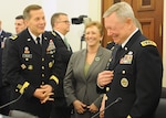 Army Gen. Frank Grass, the chief of the National Guard Bureau; Chief of the Army Reserve Lt. Gen. Jeffrey W. Talley; Army National Guard Acting Director Maj. Gen. Judd H. Lyons and Air National Guard Director Lt. Gen. Stanley E. Clarke III talk before testifying at a House Appropriations Committee Subcommittee on Defense hearing on the posture of the National Guard and Reserve March 17, 2015. (U.S. Army National Guard photo by Staff Sgt. Michelle Gonzalez)(Released)