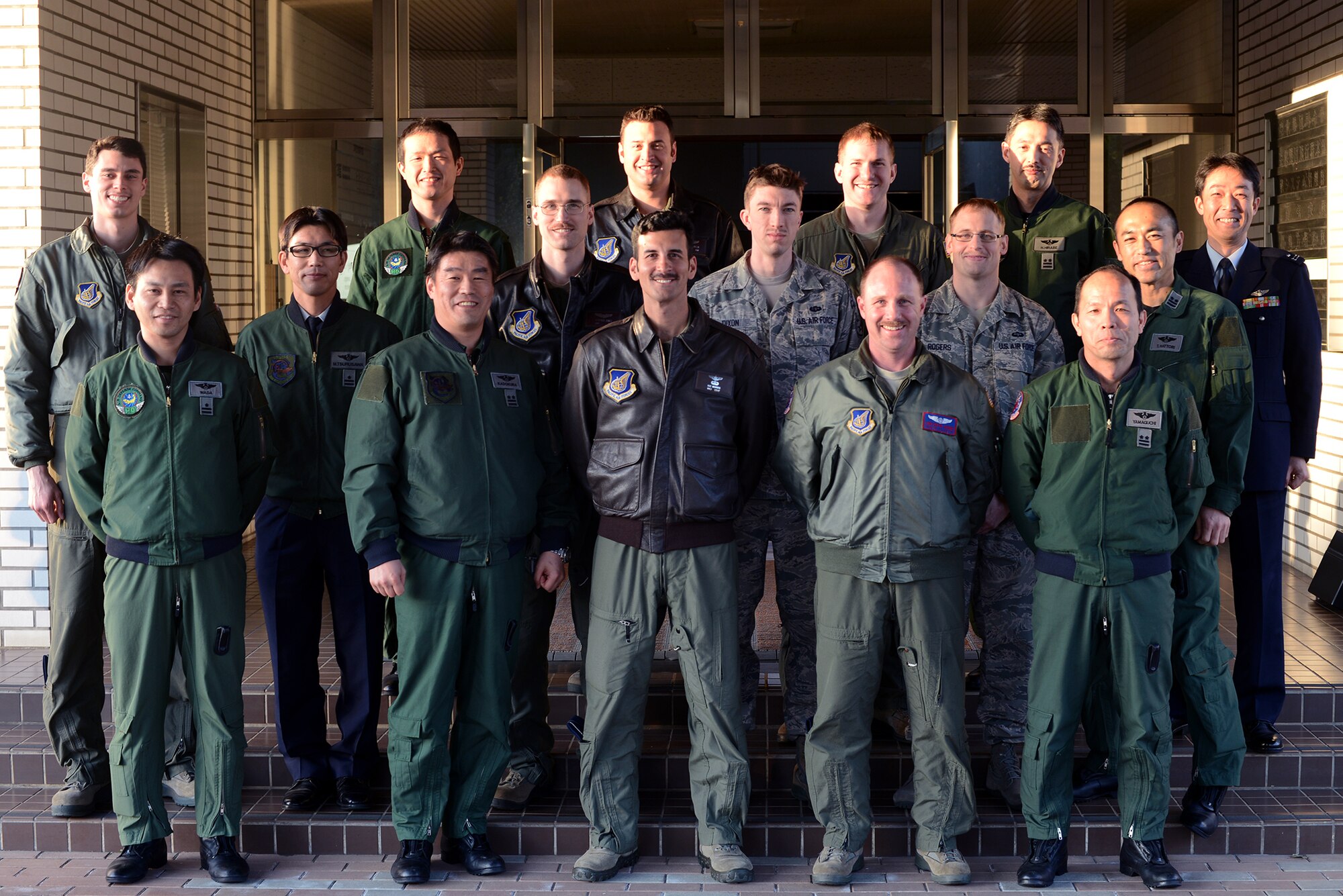 U.S. and Japan Air Self-Defense Force Airmen pose for a group photo at Iruma Air Base, Japan, March 12, 2015. The photo was taken in commemoration of the first bilateral search and rescue conference. (U.S. Air Force photo by Airman 1st Class David C. Danford/Released) 