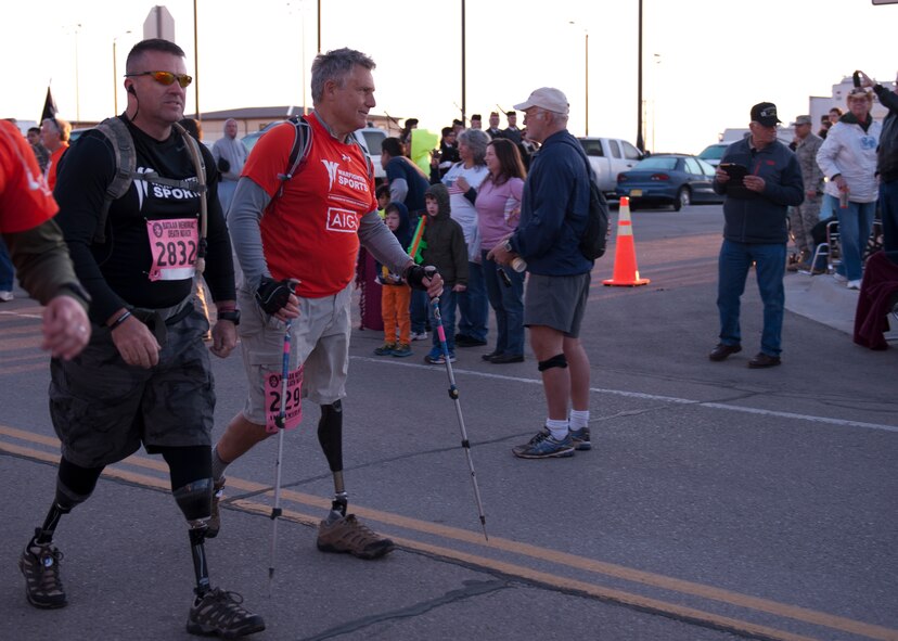 Veterans and members of the Wounded Warrior Project begin the 26.2-mile trek of the Bataan Memorial Death March at White Sands Missile Range, N.M. March 22, 2015.   The memorial event is a challenging trek through the high desert and mountain terrain of southern New Mexico. The route allowed participants to experience a small portion of what the soldiers endured during their long march through malaria-filled jungles in the Philippines. (U.S. Air Force photo by Staff Sgt. E’Lysia A. Wray/Released)
