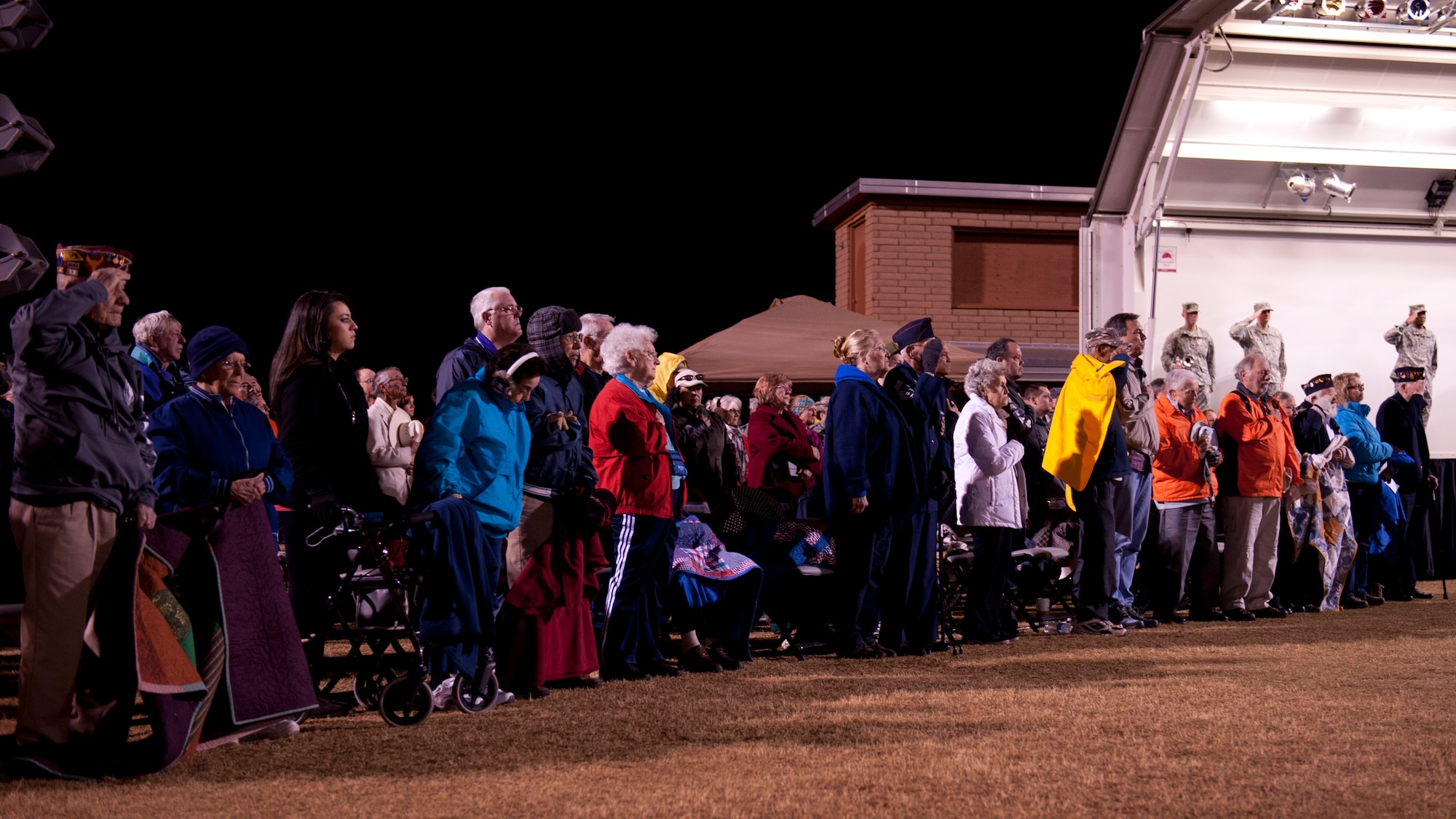 Survivors of the 1942 Bataan Death March salute the flag as the White Sands Missile Range honor guard posts the colors during the opening ceremony at WSMR, N.M., March 22, 2015. More than 5,600 people from across the world participated in the 26.2-mile memorial march to honor the 76,000 prisoners of war who were forced to endure marching nearly 65 miles under brutal conditions during World War II. (U.S. Air Force photo by Staff Sgt. E’Lysia A. Wray/Released)