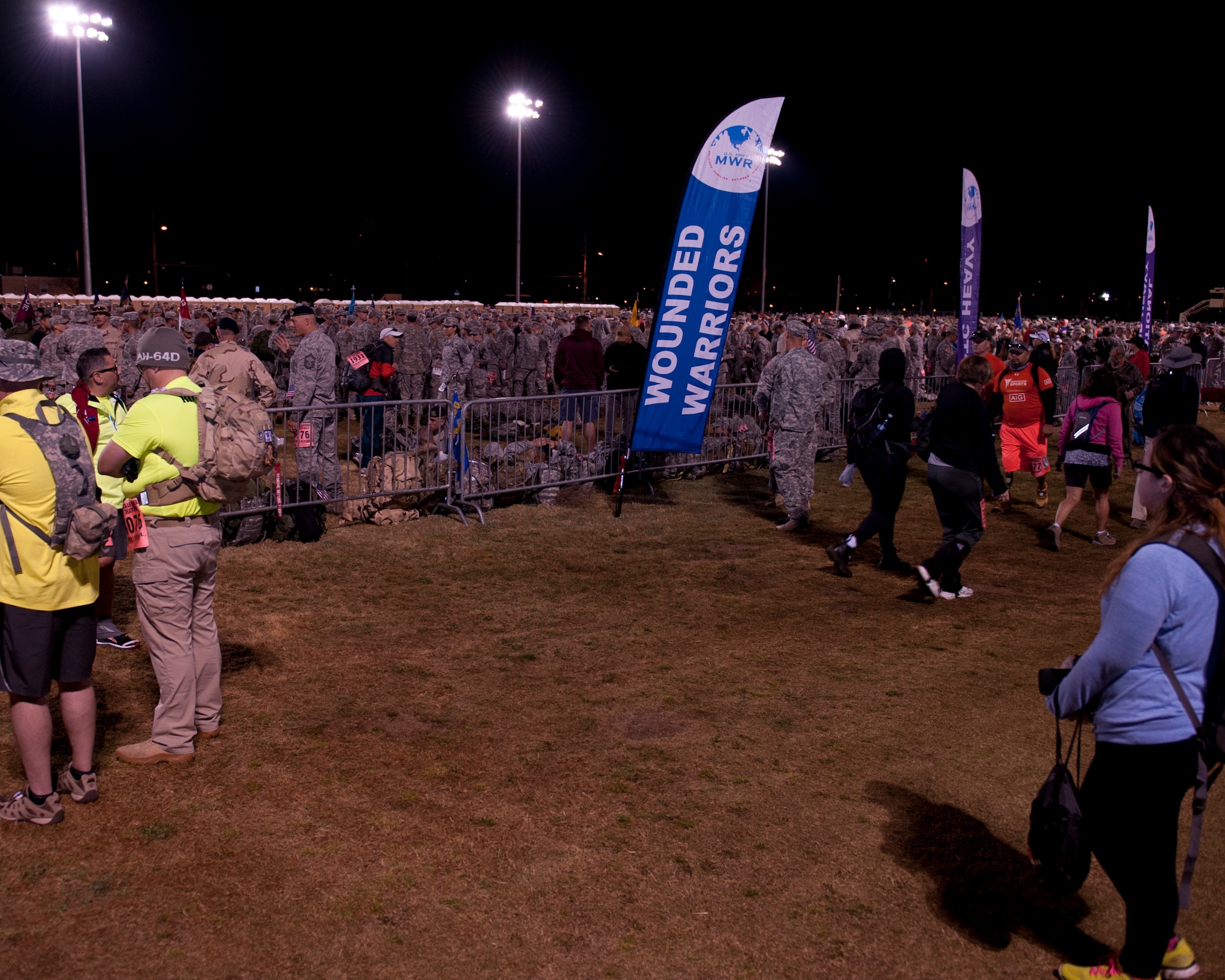 Participants in the 26th annual Bataan Memorial Death March gather during the opening ceremony at White Sands Missile Range, N.M., March 22, 2015. The Bataan Memorial Death March was created to honor the approximately 75,000 Filipino and American troops who sacrificed their freedom, health, and in many cases their lives to defend Luzon, Corregidor and harbor defense forts of the Philippines in 1942 during World War ll. (U.S. Air Force photo by Staff Sgt. E’Lysia A. Wray/Released)
