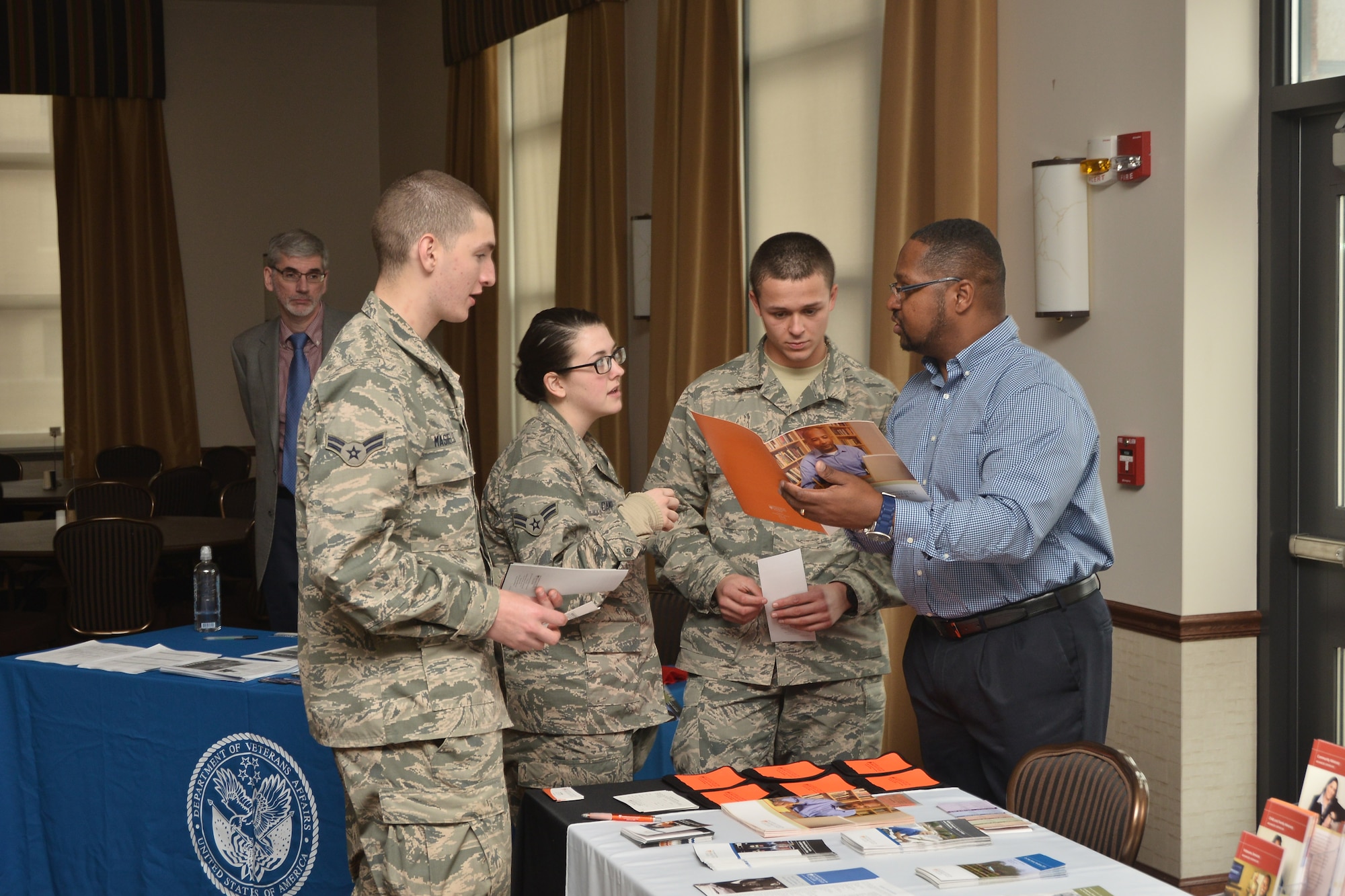 Airmen from the 107th Airlift Wing receive information from local colleges as part of a recruiting and retention education fair at the Niagara Falls Reserve Station March 21, 2015. (U.S. Air National Guard photo/Senior Master Sgt. Ray Lloyd.)