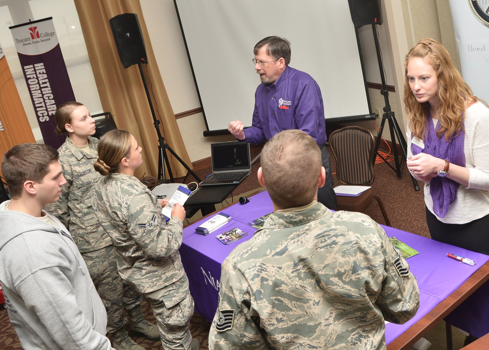 Airmen from the 107th Airlift Wing receive information from local colleges as part of a recruiting and retention education fair at the Niagara Falls Reserve Station March 21, 2015. (U.S. Air National Guard photo/Senior Master Sgt. Ray Lloyd.)