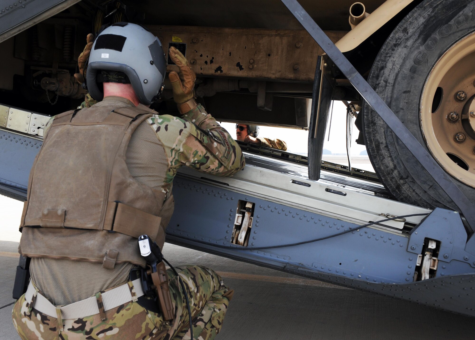 U.S. Air Force Airmen assigned to the 774th Expeditionary Airlift Squadron act as spotters as an R-11 fuel truck is loaded onto a C-130J Super Hercules aircraft during a redeployment mission at an undisclosed location in the Air Force Central Command area of responsibility March 15, 2015. The ability to forward deploy mission critical equipment, such as the R-11, to key sites throughout the AOR is more imperative than ever before as the Air Force reduces its footprint in the region. (U.S. Air Force photo by Staff Sgt. Whitney Amstutz)