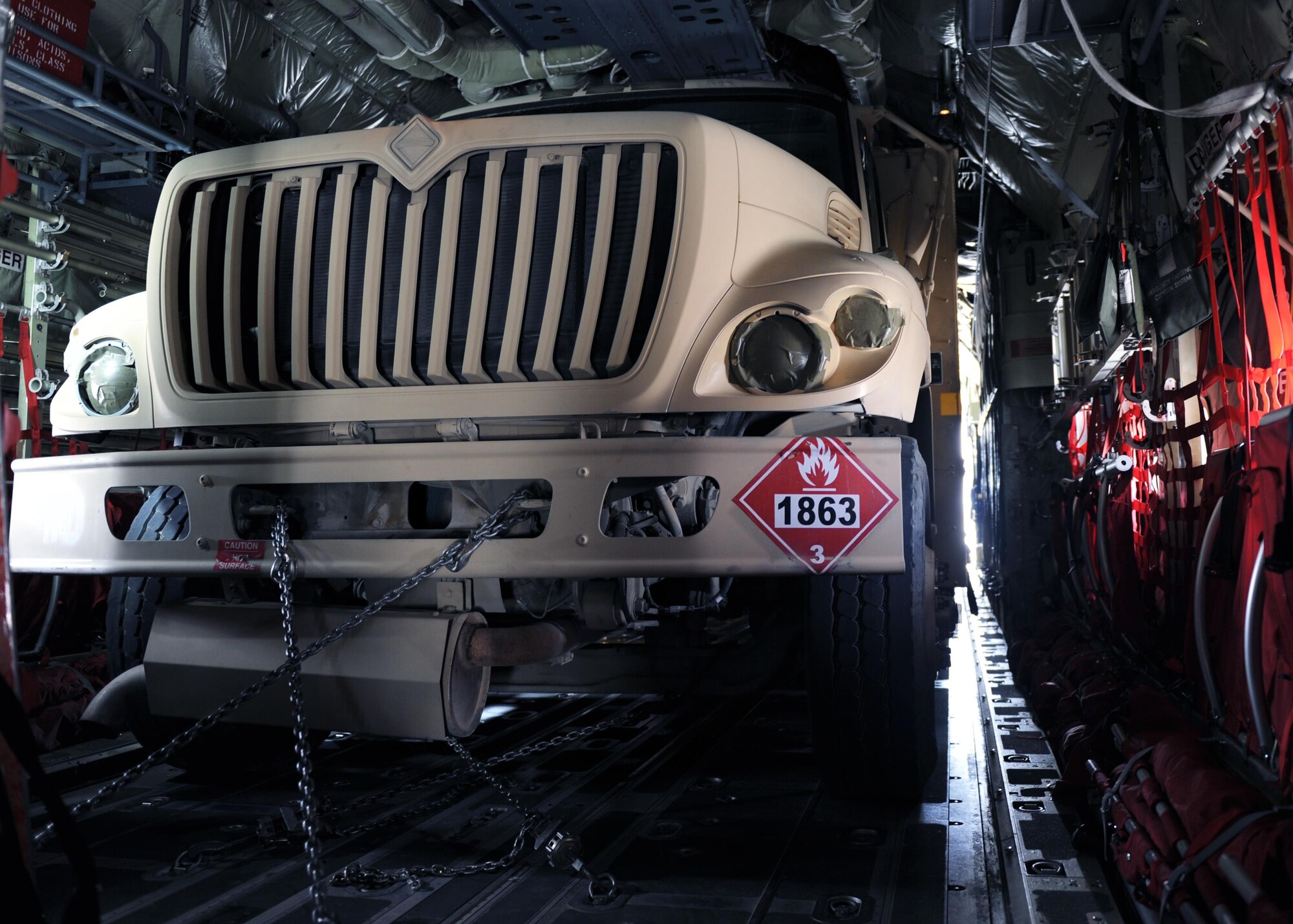 An R-11 fuel truck occupies the cargo compartment of a C-130J Super Hercules aircraft during a redeployment mission at an undisclosed location in the Air Force Central Command area of responsibility March 15, 2015. The ability to forward deploy mission critical equipment, such as the R-11, to key sites throughout the AOR is more imperative than ever before as the Air Force reduces its footprint in the region. (U.S. Air Force photo by Staff Sgt. Whitney Amstutz)