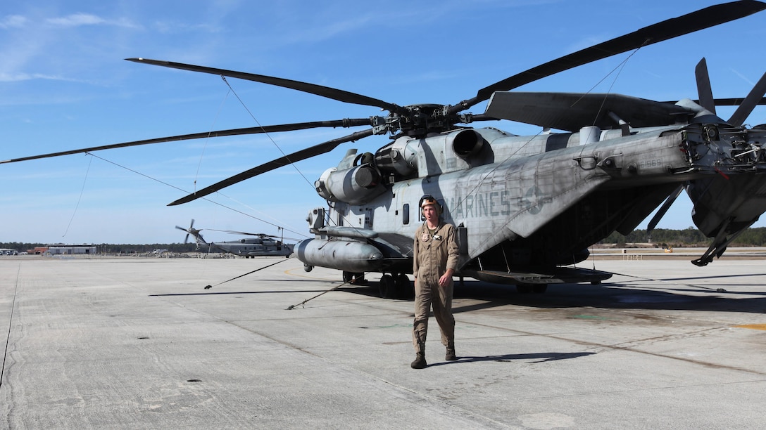Sgt. Nathaniel Lubinus walks away from a CH-53E Super Stallion at Marine Corps Air Station Cherry Point, N.C., March 12, 2015. Lubinus earned the Marine Enlisted Aircrew of the Year Award for superior performance as an enlisted aircrew member for 2014. The award was established in honor of Master Gunnery Sgt. Danny L. Radish who served with honor, distinction and heroism in Marine Aviation for over 20  years. Lubinus, a native of Ames, Iowa, is a helicopter crew chief with Marine Heavy Helicopter Squadron 366.