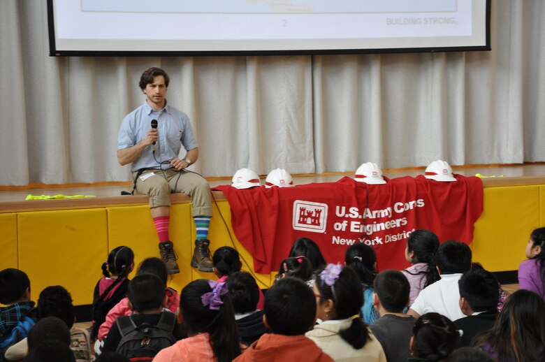 Ian Pumo, civil engineer, U.S. Army Corps of Engineers, New York District is all wacked out in multi-colored socks – in celebration of the school’s Wacky Wednesday’s theme – as he describes how engineers solve problems to improve our lives. 