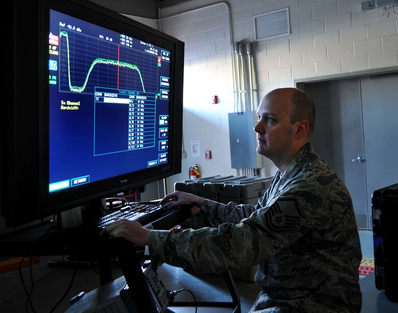 Master Sgt. Carl Champagne disrupts adversary’s communications by using spectrum monitoring tools during a simulated satellite communications electronic attack exercise April 11, 2014, in New London, N.C. Champagne is a telecommunications specialist for the 263rd Combat Communication Squadron. The 263rd CBCS hosted more than 50 active-duty, Reserve and National Guard Airmen during the joint training exercise. (U.S. Air National Guard photo/Master Sgt. Patricia F. Moran)