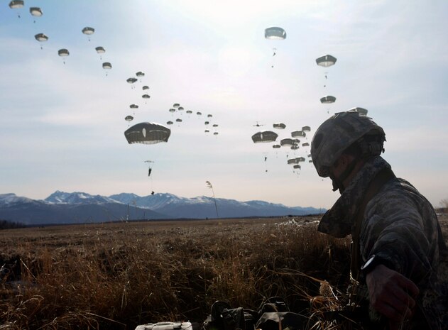 JOINT BASE ELMENDORF-RICHARDSON, Alaska (Mar. 20, 2015) - A paratrooper with 1st Battalion (Airborne), 501st Infantry Regiment, 4th Infantry Brigade Combat Team (Airborne), 25th Infantry Division gathers his T-11 parachute during Exercise Spartan Valkyrie on Malemute Drop Zone. Spartan Valkyrie is a weeklong command post exercise further validating joint readiness capabilities. 