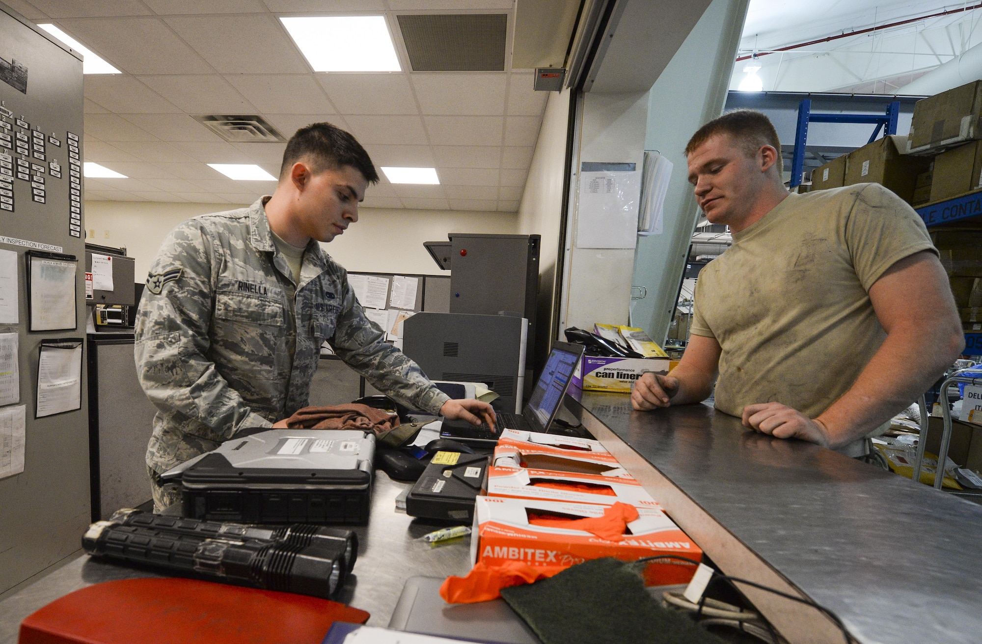 Aerospace propulsion journeymen from the 1st Special Operations Component Maintenance Squadron, check in tools at the Centralized Repair Facility, Hurlburt Field, Fla., Feb. 3, 2015. The Centralized Repair Facility is responsible for building and repairing T-56 engines and C-130 propellers. (U.S. Air Force photo Senior Airman Meagan Schutter/Released)