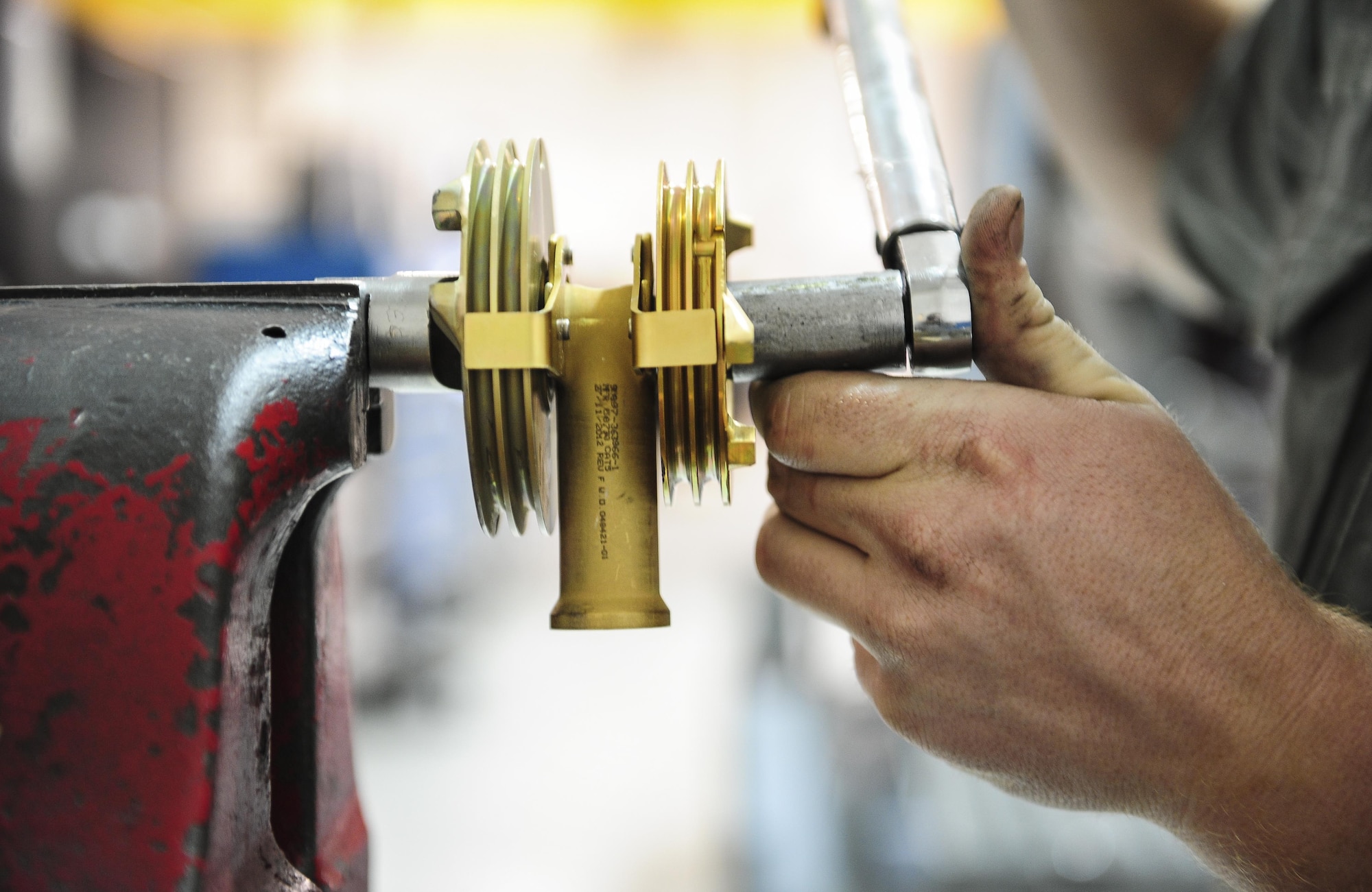 Senior Airman Brian Basore, 1st Special Operations Component Maintenance Squadron aerospace propulsion journeyman, works on a gimble at the Centralized Repair Facility, Hurlburt Field, Fla., Feb. 3, 2015. The Centralized Repair Facility is responsible for building and repairing T-56 engines and C-130 propellers. (U.S. Air Force photo Senior Airman Meagan Schutter/Released)