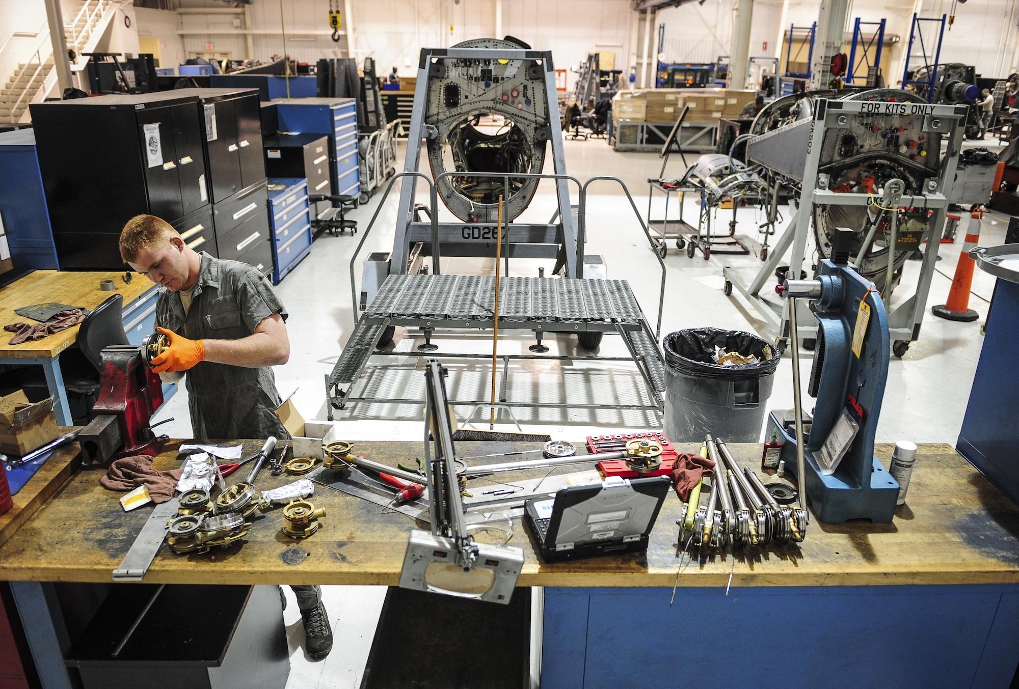 Senior Airman Brian Basore, 1st Special Operations Component Maintenance Squadron aerospace propulsion journeyman, works on a gimble at the Centralized Repair Facility, Hurlburt Field, Fla., Feb. 3, 2015. The Centralized Repair Facility is responsible for building and repairing T-56 engines and C-130 propellers. (U.S. Air Force photo Senior Airman Meagan Schutter/Released)