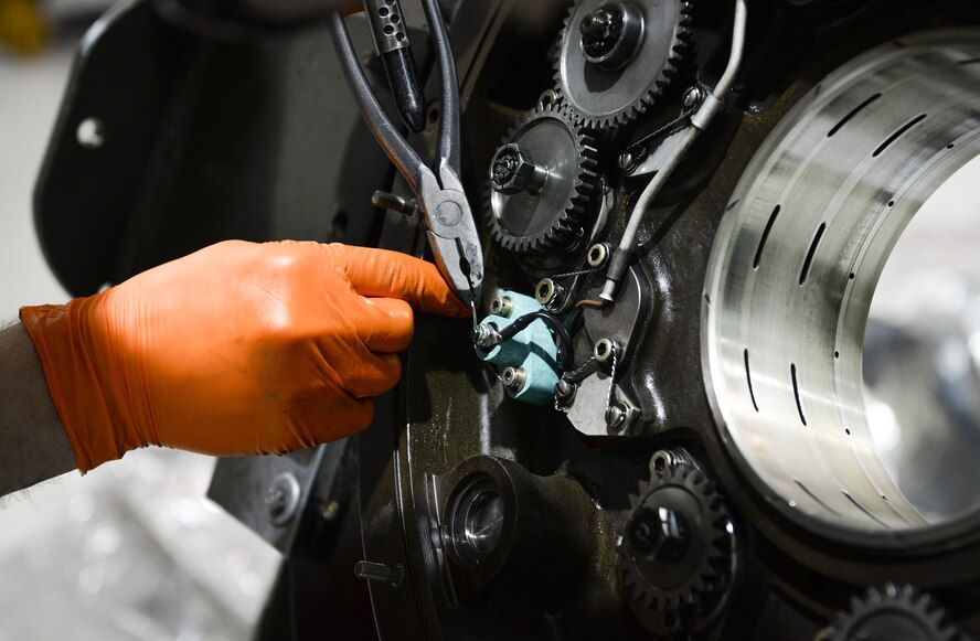 A Pressure cut-out switch is replaced on an MC-130 propeller at the Centralized Repair Facility, Hurlburt Field, Fla., Feb. 3, 2015. The Centralized Repair Facility is responsible for building and repairing T-56 engines and C-130 propellers. (U.S. Air Force photo Senior Airman Meagan Schutter/Released)