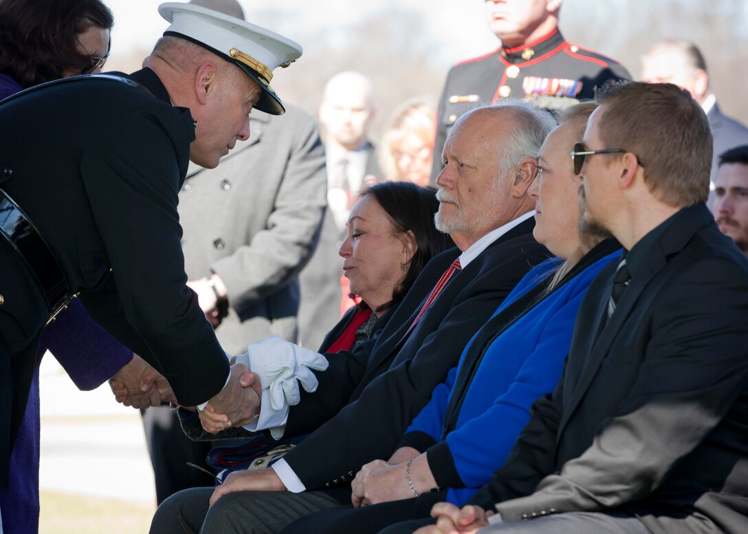 The Assistant Commandant of the U.S. Marine Corps, Gen. John M. Paxton Jr., left, speaks with the family members of retired U.S. Marine Corps Cpl. Casey Owens during the funeral services in honor of Owens at the Arlington National Cemetery, Arlington, Va., March 23, 2015. (U.S. Marine Corps photo by Cpl. Tia Dufour/Released)