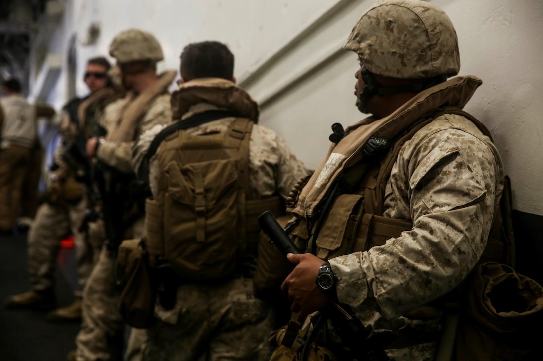 U.S. Marines with the 15th Marine Expeditionary Unit prepare to depart the USS Essex (LHD 2) during Composite Training Unit Exercise (COMPTUEX) March 20, 2015. These Marines were going back to the USS Anchorage (LPD-23) after executing a raid aboard Camp Pendleton, Calif. (U.S. Marine Corps photo by Cpl. Anna Albrecht/Released)